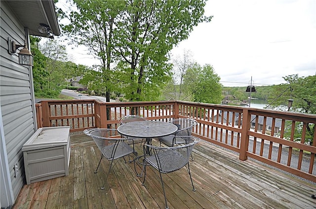 wooden terrace with outdoor dining space