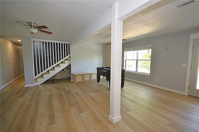 3 Evelynia Cir, Bella Vista, AR 72715 - unfurnished living room with stairway, ceiling fan, light wood-style flooring, and visible vents