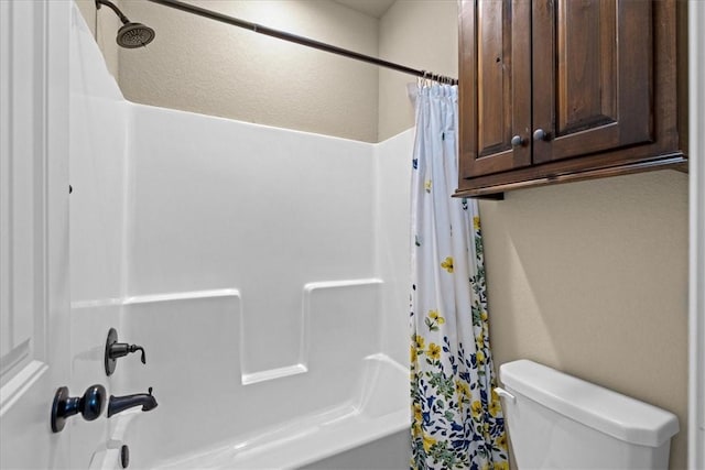 bathroom with toilet and shower / tub combo with curtain