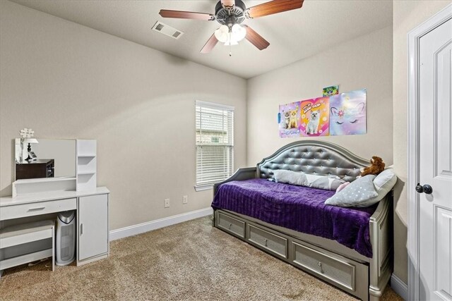 bedroom featuring visible vents, baseboards, carpet floors, and ceiling fan