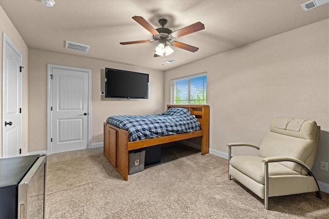 bedroom featuring baseboards, visible vents, and carpet