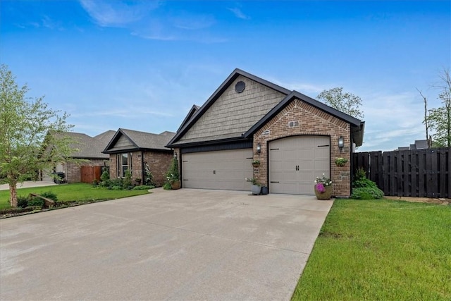 craftsman-style home featuring fence, a front lawn, brick siding, a garage, and concrete driveway
