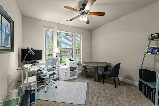 home office featuring carpet floors, a ceiling fan, baseboards, and visible vents