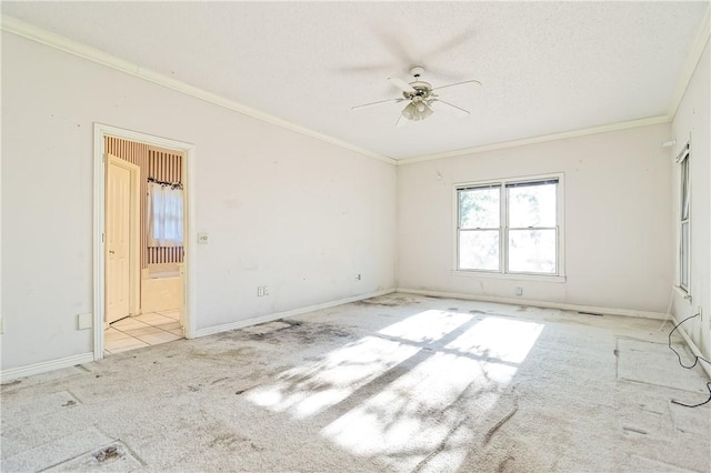 unfurnished bedroom with carpet floors, baseboards, and crown molding