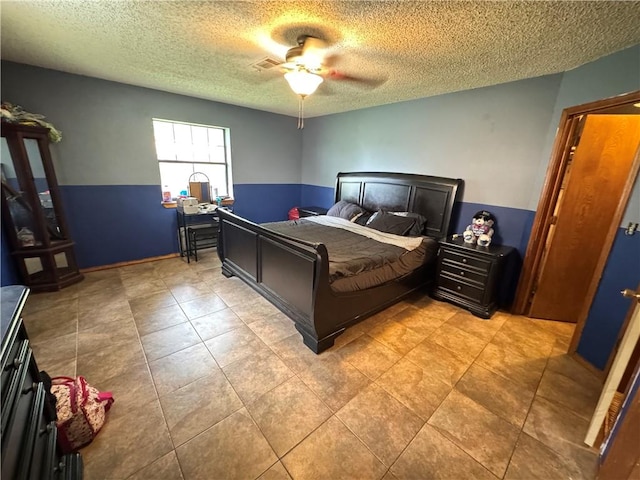 60 N Redwood Cir, Sallisaw, OK 74955 - bedroom featuring ceiling fan, a textured ceiling, and visible vents