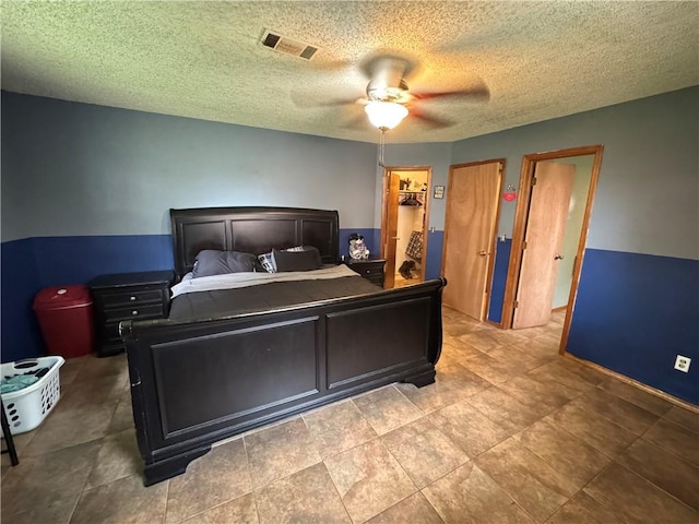 60 N Redwood Cir, Sallisaw, OK 74955 - bedroom with a ceiling fan, a textured ceiling, and visible vents