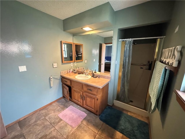 60 N Redwood Cir, Sallisaw, OK 74955 - bathroom with vanity, baseboards, a textured ceiling, and a stall shower
