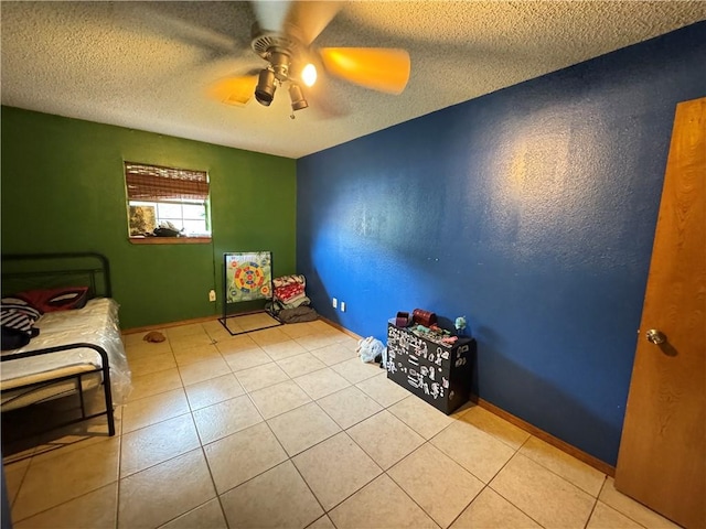 60 N Redwood Cir, Sallisaw, OK 74955 - tiled bedroom featuring a textured ceiling and ceiling fan