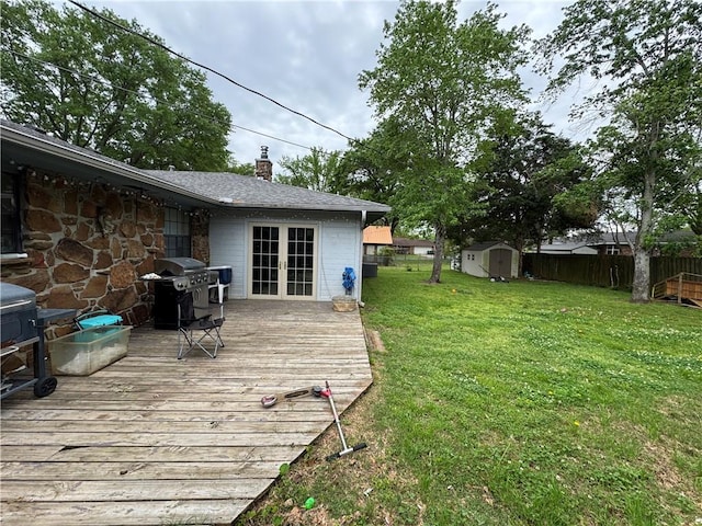 60 N Redwood Cir, Sallisaw, OK 74955 - wooden deck with a storage shed, grilling area, a fenced backyard, french doors, and a lawn