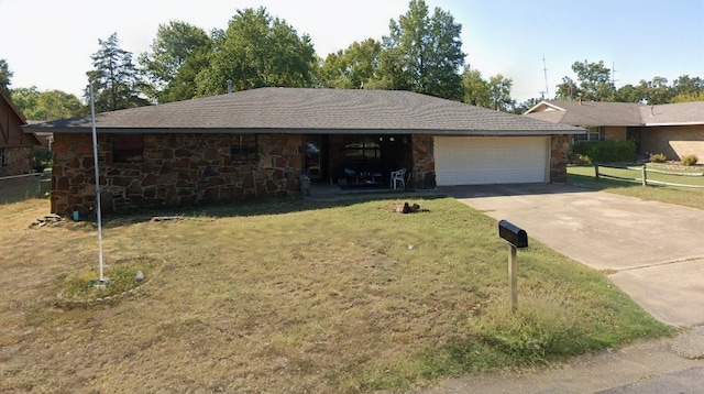 60 N Redwood Cir, Sallisaw, OK 74955 - ranch-style house with a garage, fence, stone siding, and concrete driveway