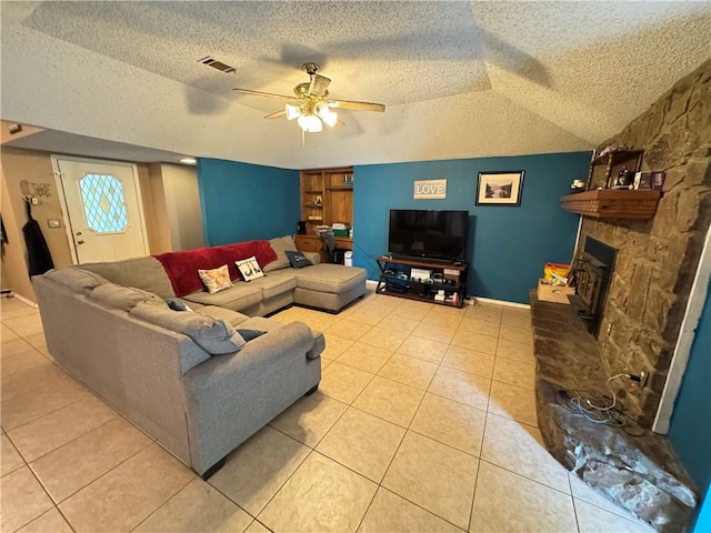 60 N Redwood Cir, Sallisaw, OK 74955 - living area featuring visible vents, a textured ceiling, ceiling fan, and light tile patterned floors