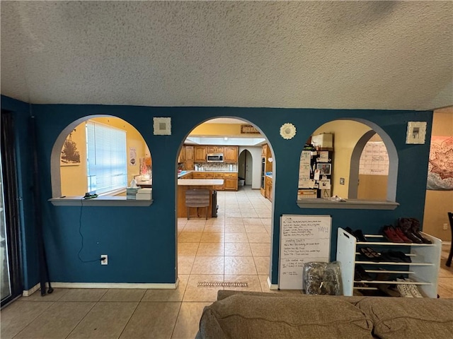 60 N Redwood Cir, Sallisaw, OK 74955 - living area with a textured ceiling and light tile patterned floors
