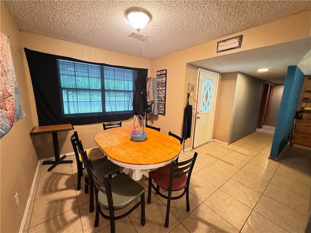 60 N Redwood Cir, Sallisaw, OK 74955 - dining area with baseboards, a textured ceiling, light tile patterned floors, and visible vents
