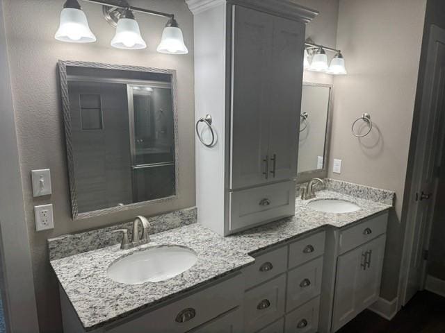 bathroom with double vanity and a sink