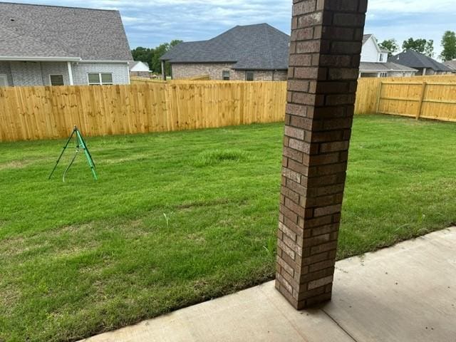 view of yard with a patio and a fenced backyard