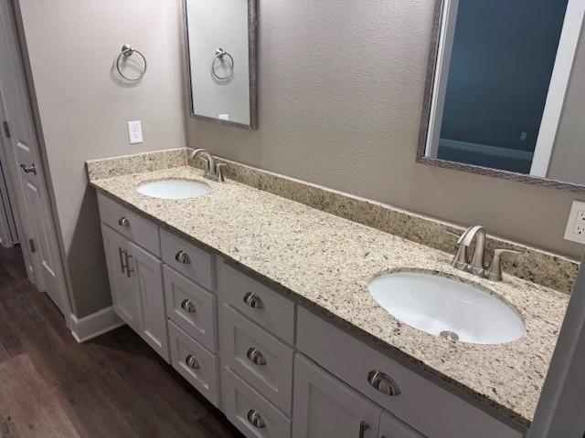 681 Baggett St, Prairie Grove, AR 72753 - full bath featuring double vanity, a sink, and wood finished floors