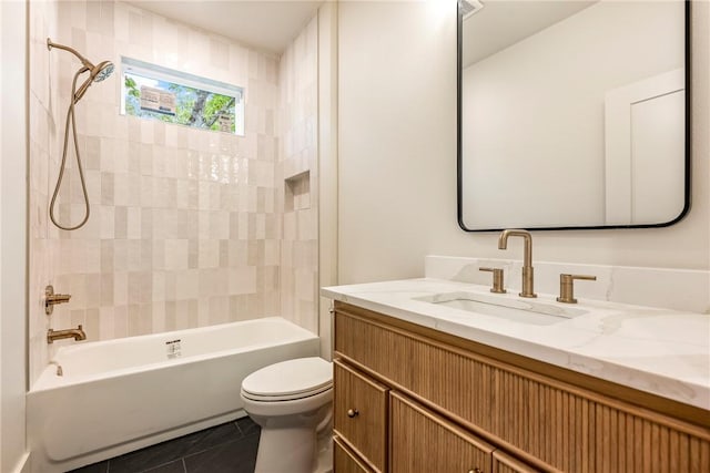 bathroom with vanity, tile patterned flooring, bathtub / shower combination, and toilet