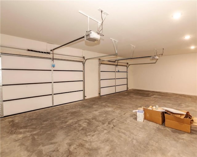 garage featuring recessed lighting and a garage door opener