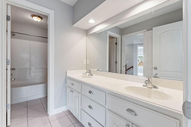 full bath with a sink, tile patterned flooring, shower / tub combination, and double vanity