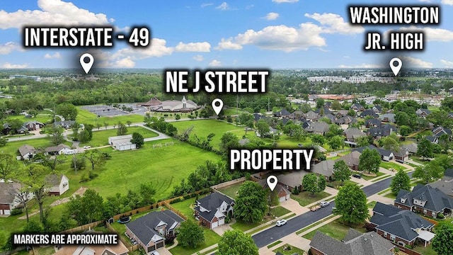 birds eye view of property with a residential view
