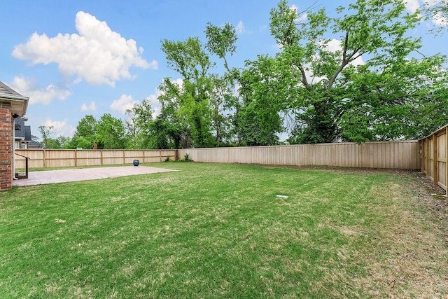 view of yard featuring a fenced backyard and a patio area