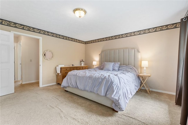 carpeted bedroom featuring baseboards