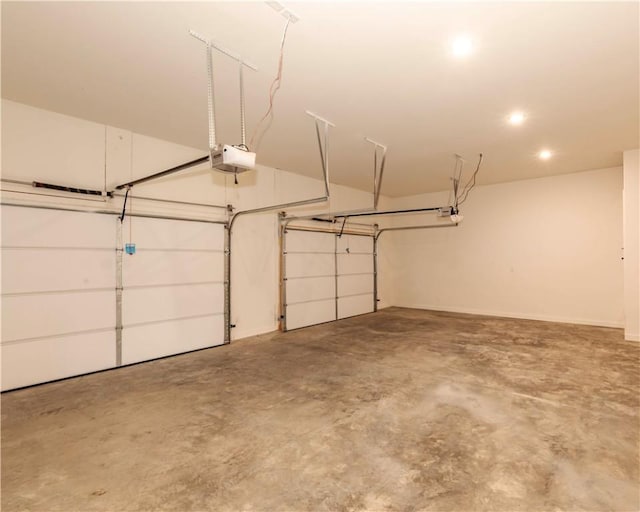 garage featuring a garage door opener and recessed lighting