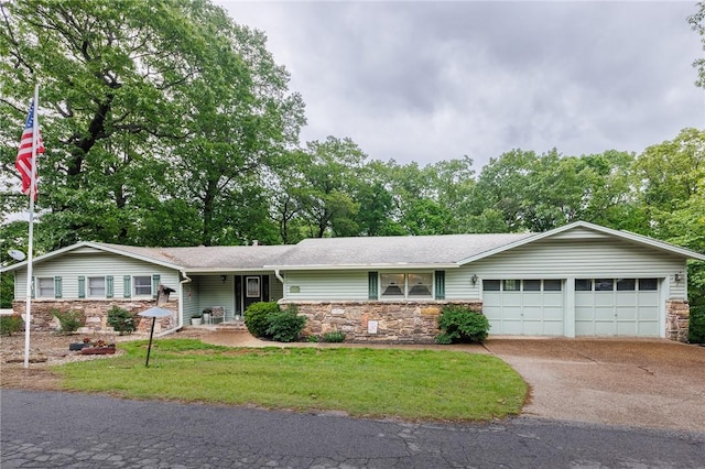 1 Panbury Ln, Bella Vista, AR 72715 - ranch-style home featuring stone siding, a garage, driveway, a front yard, and roof with shingles