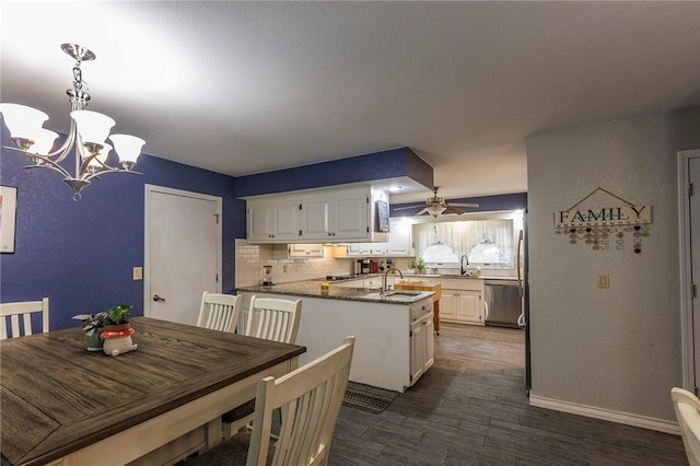 1 Panbury Ln, Bella Vista, AR 72715 - dining room with a chandelier, dark wood-style floors, ceiling fan, and baseboards