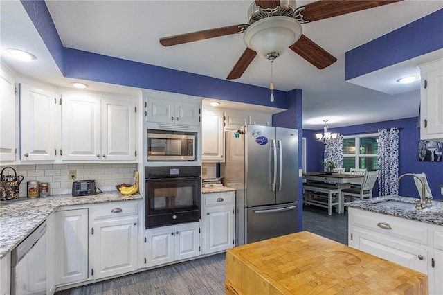 1 Panbury Ln, Bella Vista, AR 72715 - kitchen with stainless steel appliances, a sink, light wood finished floors, ceiling fan, and backsplash