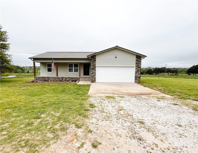 ranch-style home featuring a garage, covered porch, driveway, and stone siding