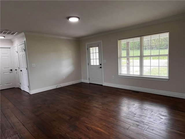 foyer with baseboards and dark wood-style flooring