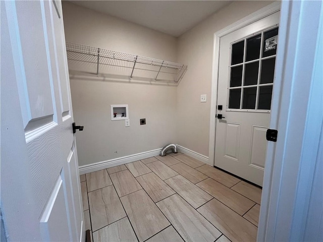 laundry area featuring laundry area, hookup for a washing machine, baseboards, and hookup for an electric dryer