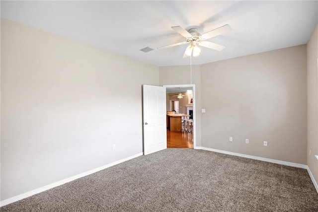 2314 W 7th St, Russellville, AR 72801 - carpeted spare room featuring a ceiling fan, baseboards, and visible vents