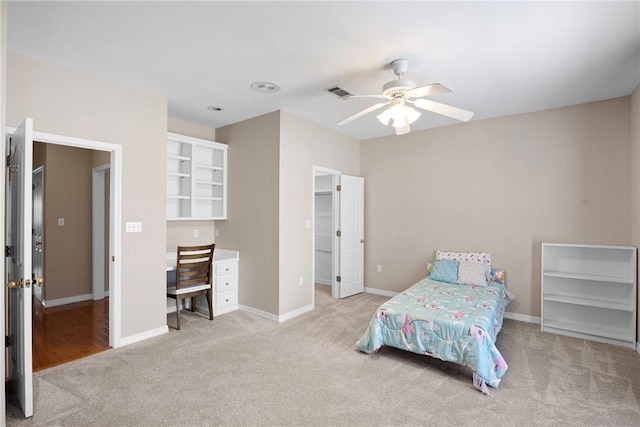 2314 W 7th St, Russellville, AR 72801 - bedroom featuring visible vents, baseboards, light colored carpet, a spacious closet, and a ceiling fan
