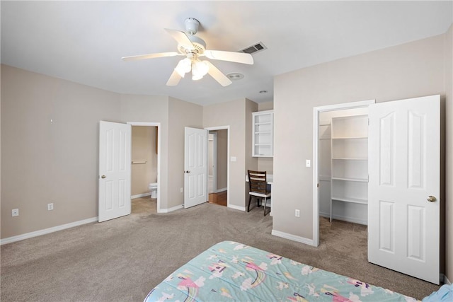 2314 W 7th St, Russellville, AR 72801 - unfurnished bedroom with baseboards, carpet, ensuite bath, and a spacious closet