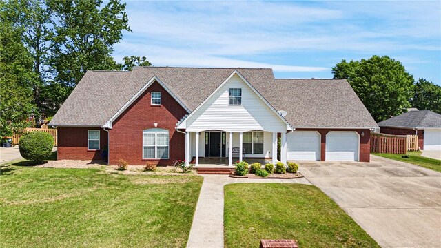 2314 W 7th St, Russellville, AR 72801 - view of front of home with a porch, driveway, a front yard, and brick siding