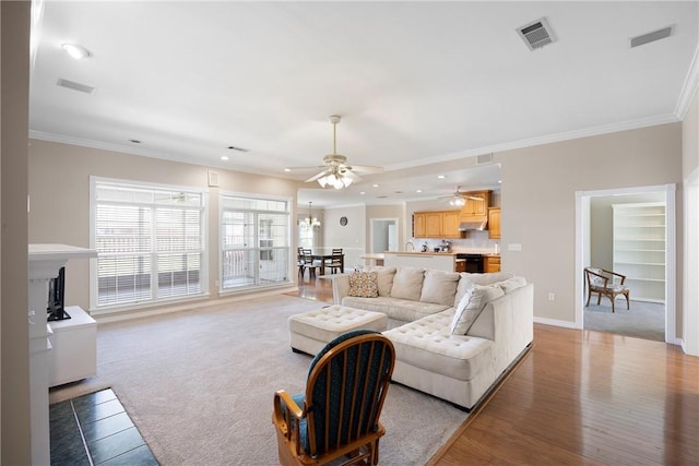 2314 W 7th St, Russellville, AR 72801 - living room featuring visible vents, ornamental molding, baseboards, recessed lighting, and ceiling fan with notable chandelier