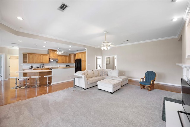 2314 W 7th St, Russellville, AR 72801 - living room featuring visible vents, crown molding, ceiling fan, recessed lighting, and light colored carpet