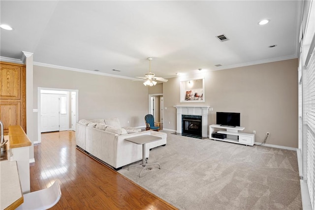 2314 W 7th St, Russellville, AR 72801 - living area with a ceiling fan, visible vents, a high end fireplace, crown molding, and baseboards