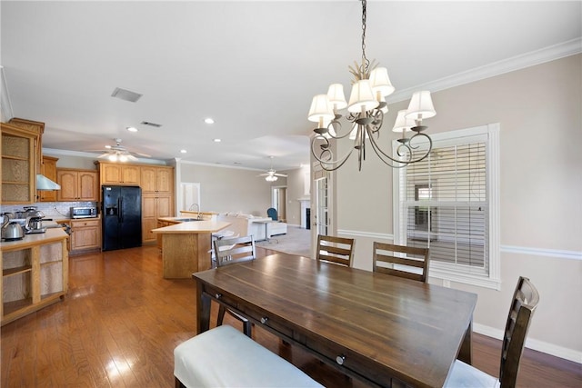 2314 W 7th St, Russellville, AR 72801 - dining room featuring visible vents, ornamental molding, wood finished floors, recessed lighting, and ceiling fan with notable chandelier