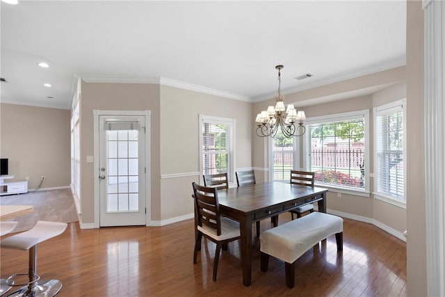 2314 W 7th St, Russellville, AR 72801 - dining area featuring crown molding, baseboards, wood finished floors, and a chandelier