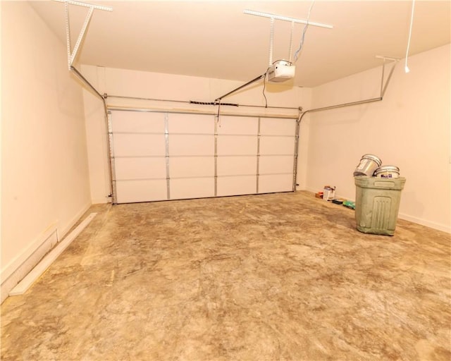 garage with baseboards and a garage door opener