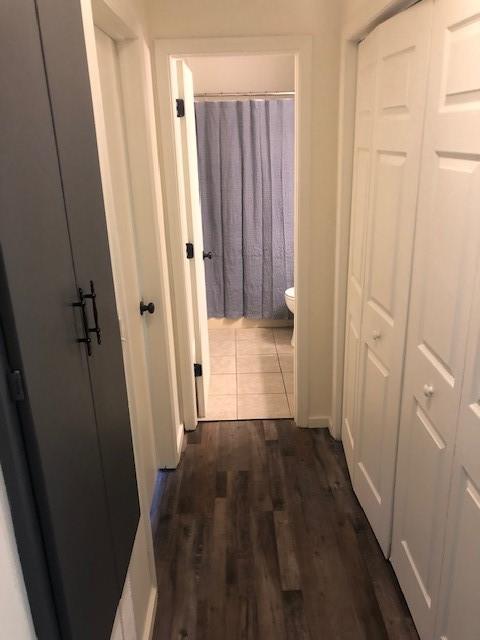 hall featuring dark wood-type flooring