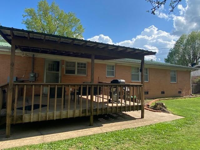 503 Skyline Dr, Harrison, AR 72601 - back of property featuring crawl space, a deck, a lawn, and brick siding