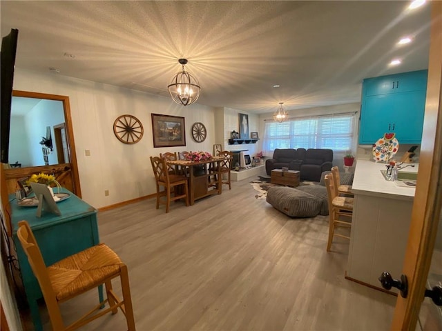503 Skyline Dr, Harrison, AR 72601 - living area featuring a chandelier, light wood-style floors, baseboards, and recessed lighting