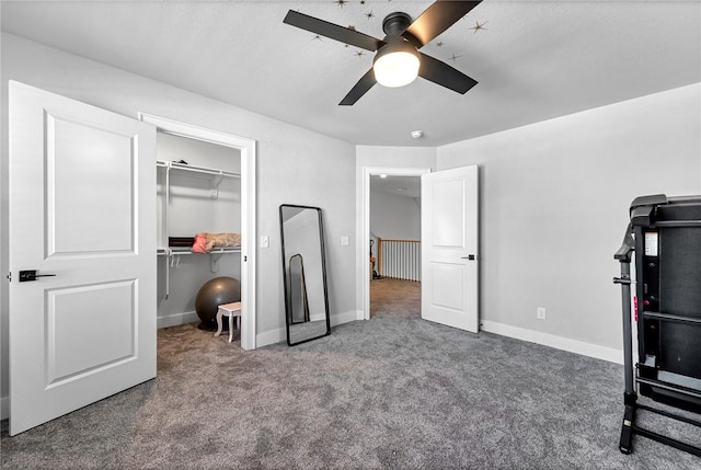 1701 S 23rd Pl, Rogers, AR 72758 - carpeted bedroom featuring a closet, a walk in closet, baseboards, and a ceiling fan