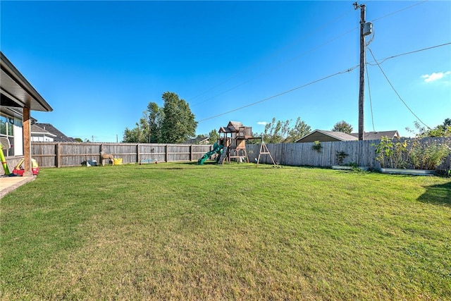 1701 S 23rd Pl, Rogers, AR 72758 - view of yard with a playground and a fenced backyard