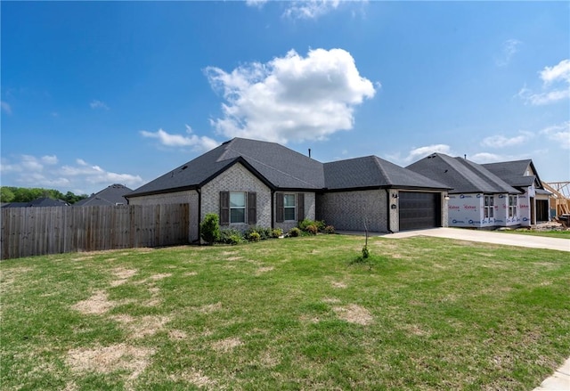 single story home featuring fence, brick siding, a garage, a front yard, and concrete driveway