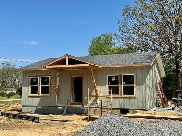 view of front of home featuring roof with shingles and crawl space